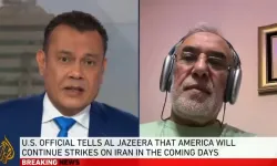 Hakan Fidan'ın yardımcısı, Al Jazeera'ye tişörtle bağlandı!